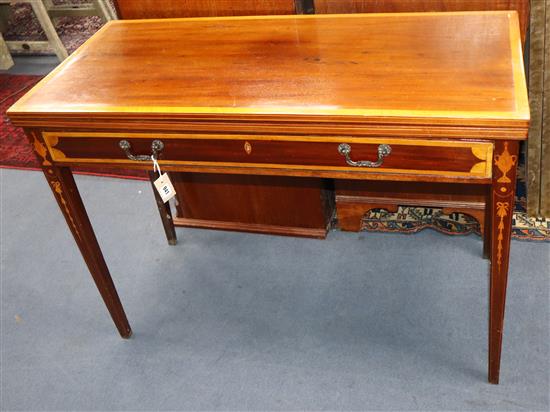 An inlaid mahogany tea table with folding top W.104cm